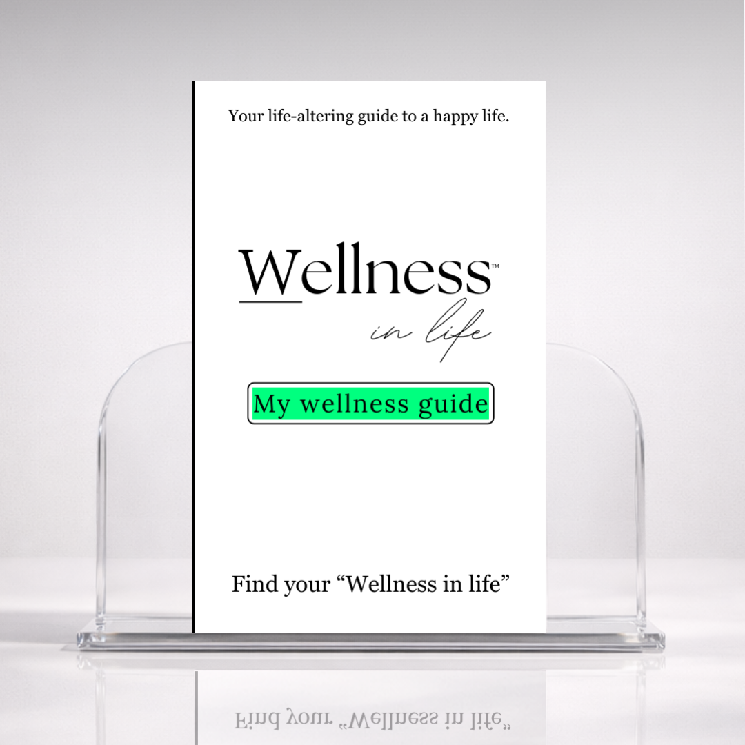 White digital eBook titled 'My Wellness Guide' from 'Wellness In Life' in a professional hero photo on a stand with a white background. A 20 page blueprint on finding and creating true wellness in life, beyond societal definitions of 'wellness'.