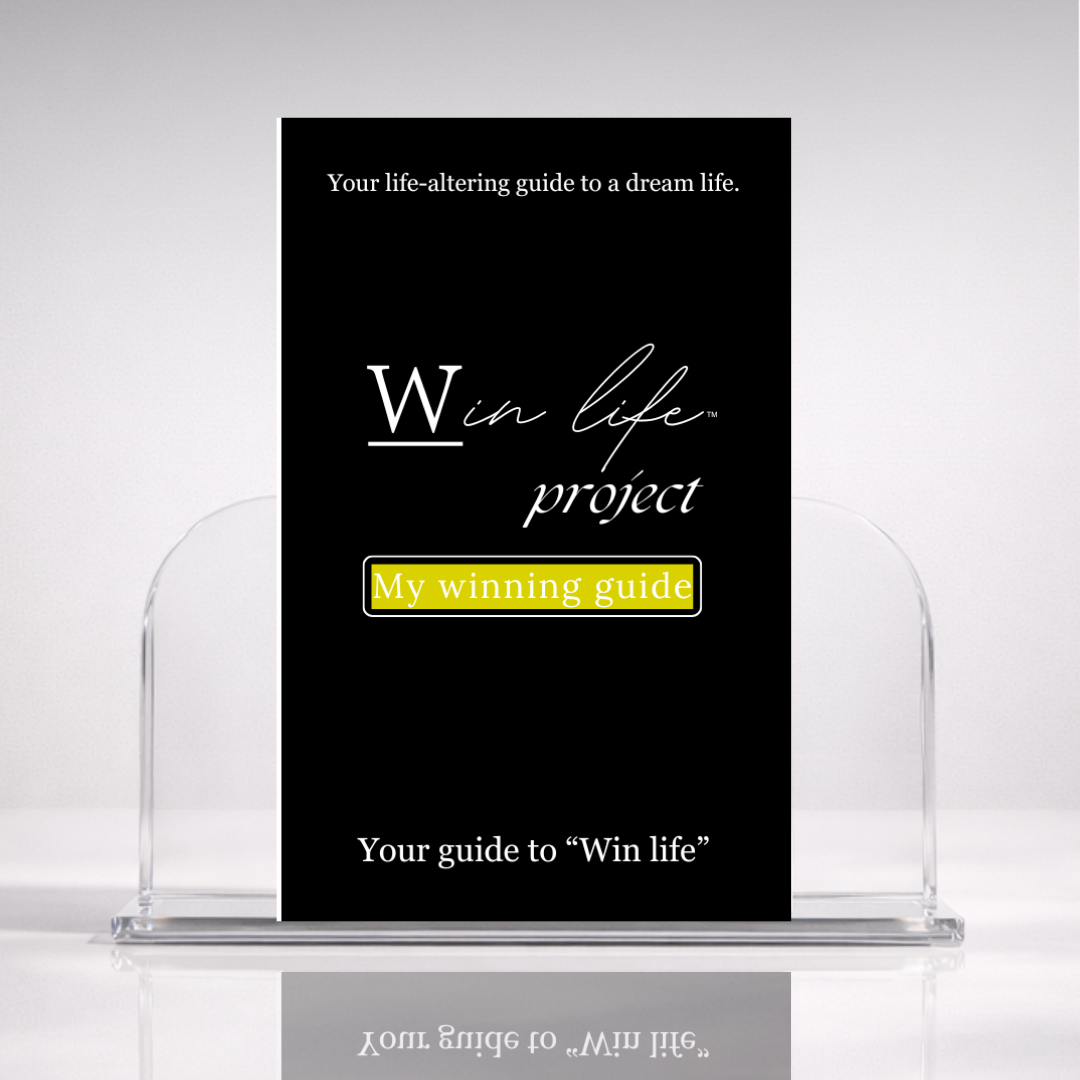 Black eBook titled 'My Winning Guide' from the 'Win Life Project' in a professional hero photo on a stand with a white background. A 20 page blueprint on what winning truly means, and how to win life holistically, on your own authentic terms.